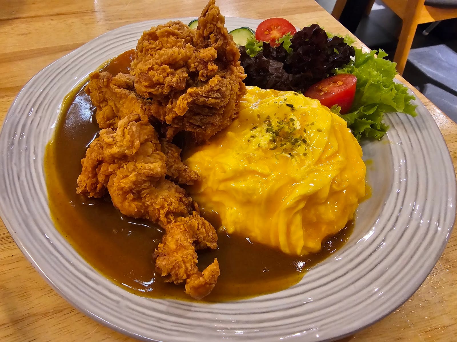 Karaage curry omu rice — fried chicken and folded egg omurice in Japanese curry sauce
