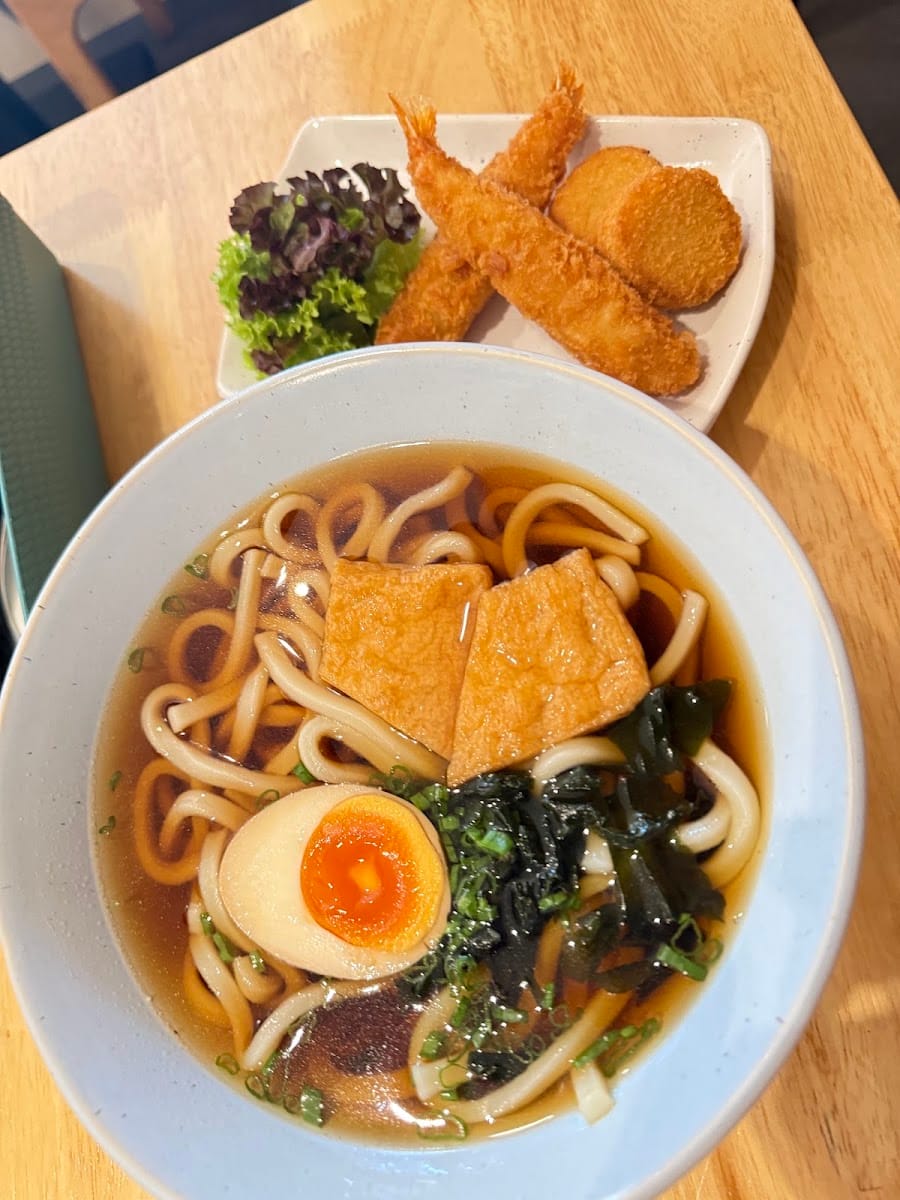 Udon noodle soup with a soft egg, fried tofu and seaweed